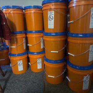 Stackable Orange Buckets with Blue Lids